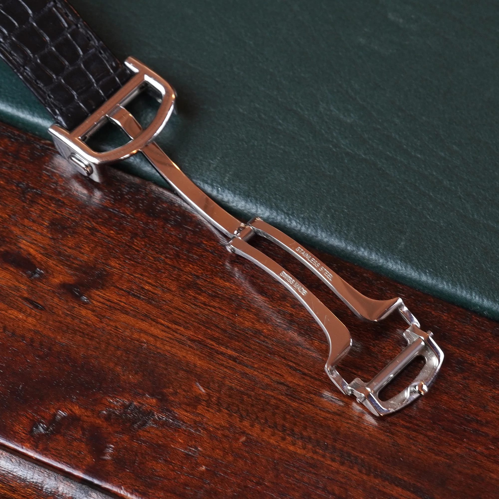 Steel folding clasp on the black crocodile leather strap