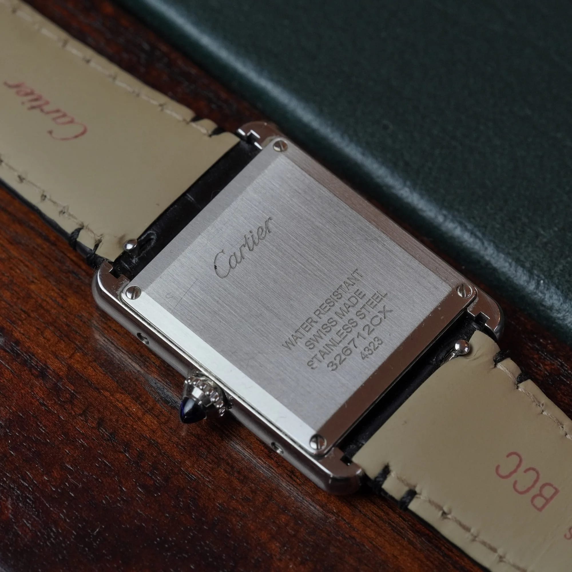 Stainless steel caseback with Cartier engraving